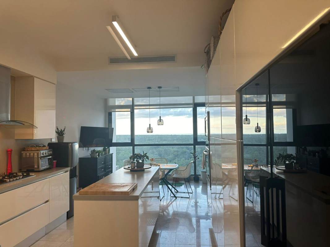 Contemporary living dining area with marble floors, floor-to-ceiling windows, balcony access PH Albatross