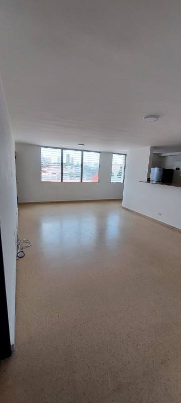 Modern kitchen with granite countertops and white cabinetry in Betania apartment Panama City