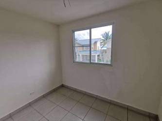 Empty bedroom with tile flooring and large window PH Playa Mar Playa Dorada Panama