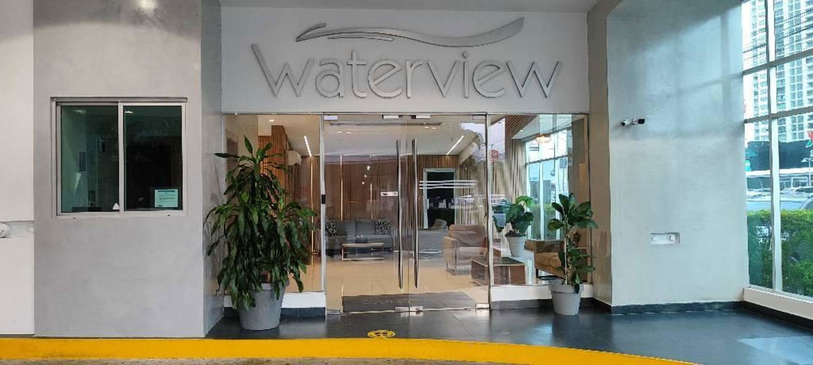 Secure modern lobby entry with seating, PH Waterview Panama City San Francisco