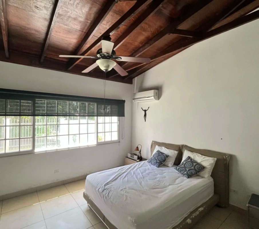 Bedroom with exposed beams ceiling, AC, large windows, minimalist decor Llanos de Curundu Panama