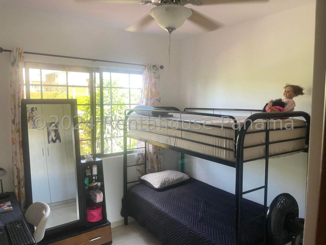 Bedroom perfect for kids or guests with window overlooking garden