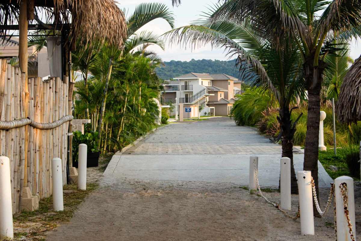 Driveway with tropical landscaping leading to beachfront condos Punta Chame