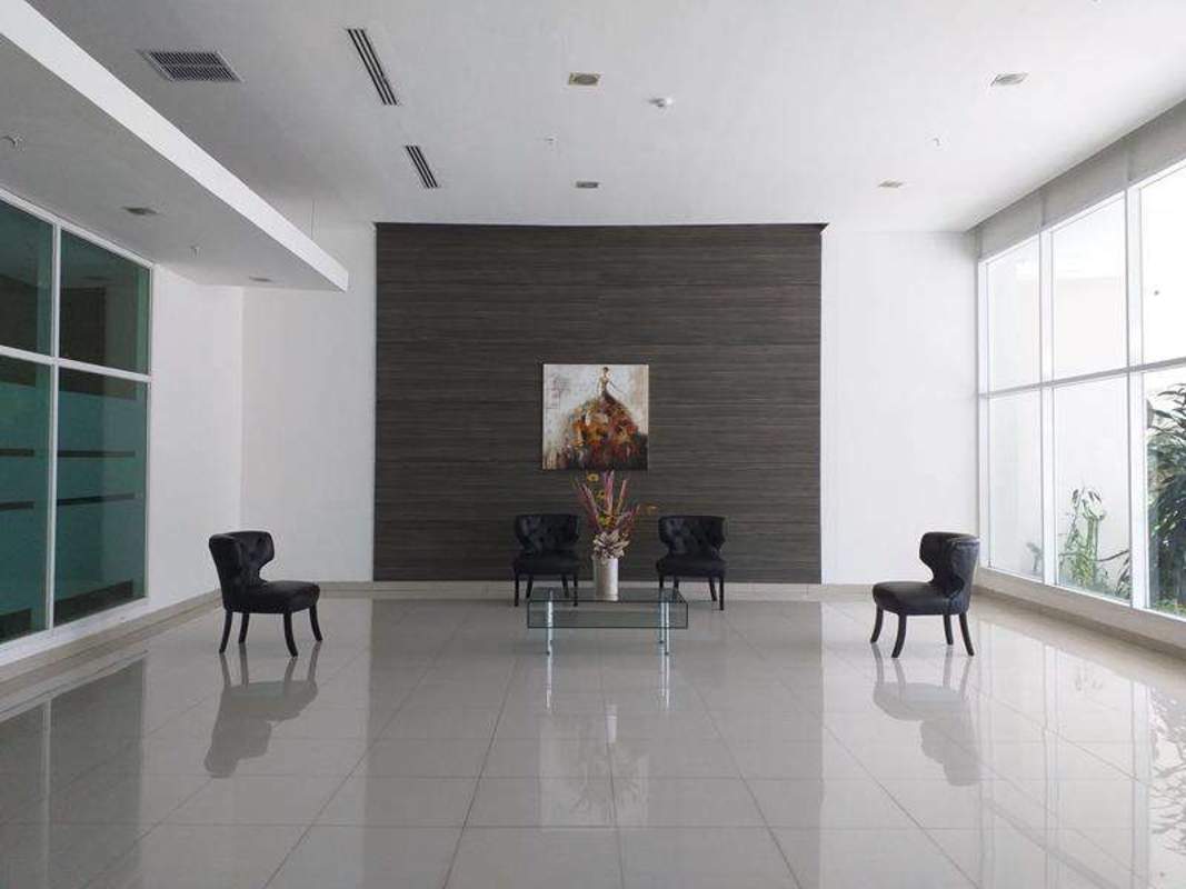 Empty bedroom with window overlooking Panama City in PH Kings Park Condado del Rey