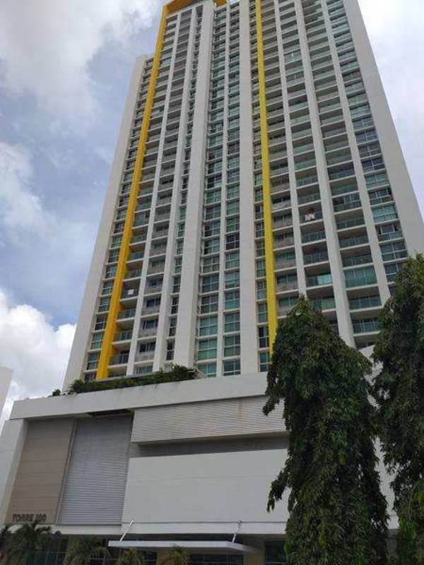 Modern high-rise condominium tower PH Kings Park with balconies and yellow accents in Condado del Rey Panama