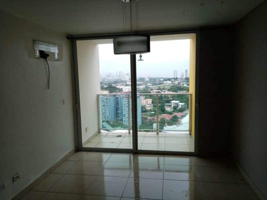Minimalist lobby with floor-to-ceiling windows, modern furniture in PH Kings Park Condado del Rey Panama