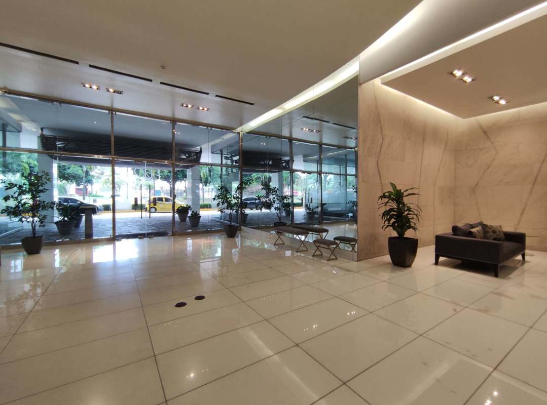 Modern open kitchen and dining with appliances in PH H2O condominium Panama