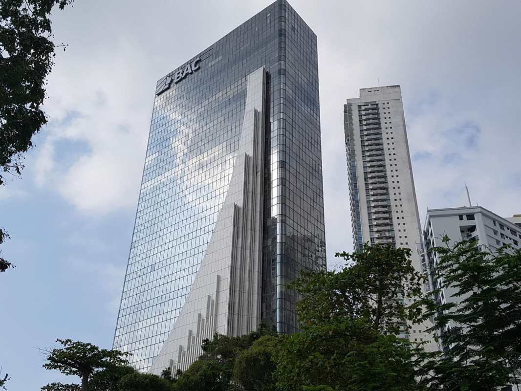 Modern glass tower facade in business district Costa del Este Panama City