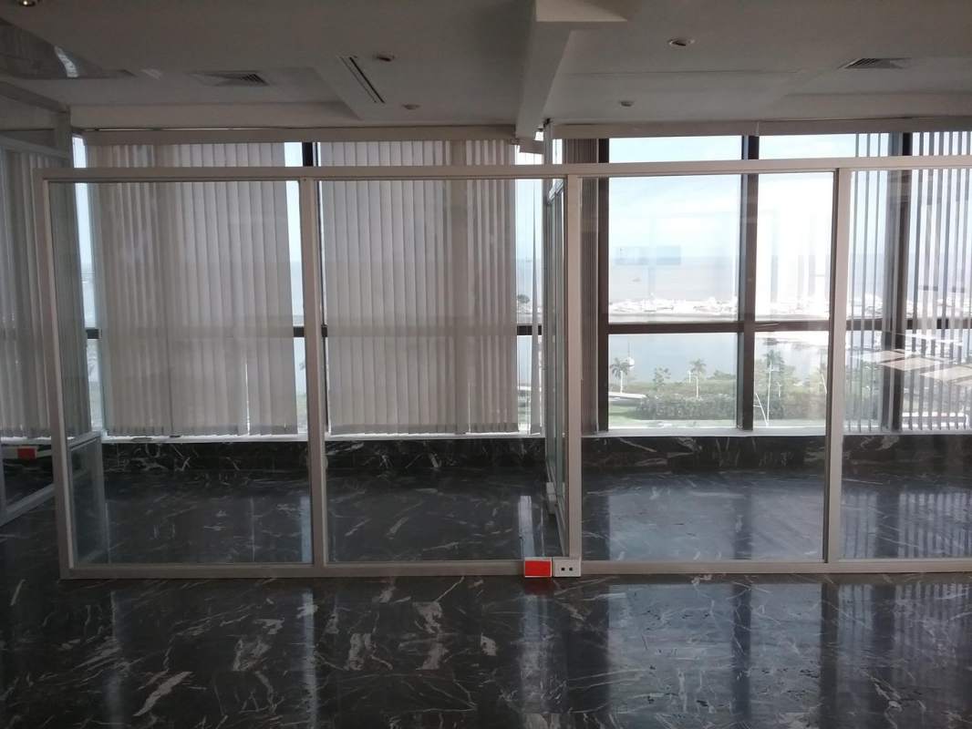 Spacious office with panoramic windows, glass partitions, marble floors at Costa del Este Corporate Center Panama City