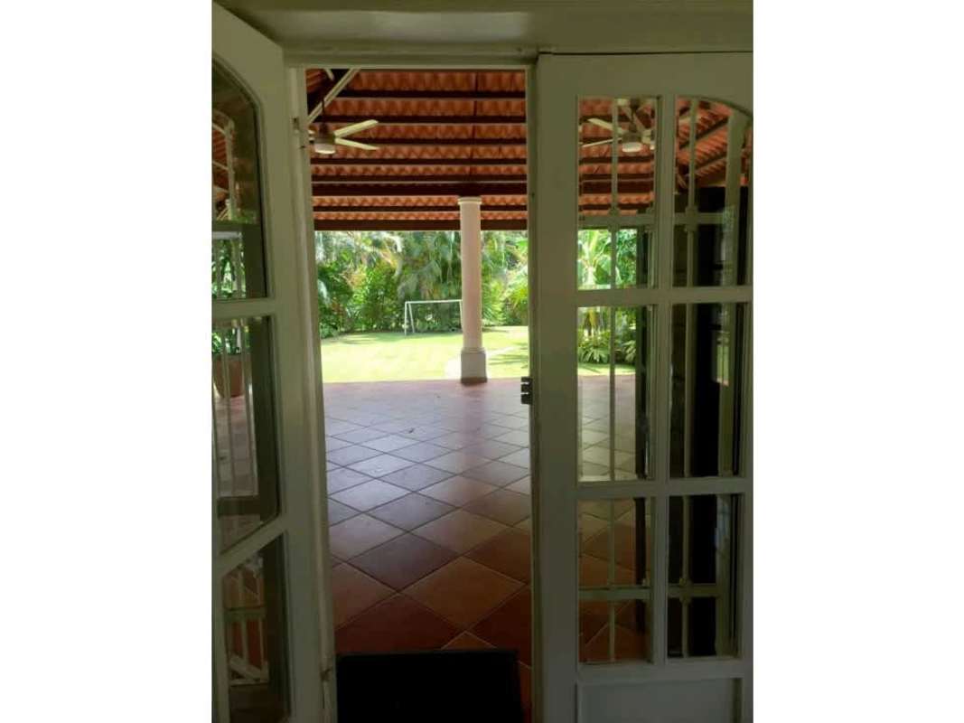Landscaped backyard with covered terrace and soccer space in Ancon Panama rental house
