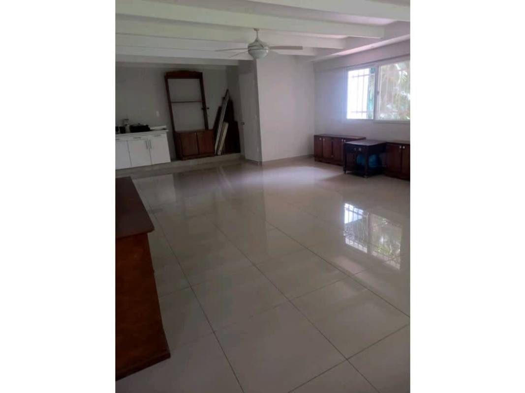 Bright living room with large window, tiled floor and ceiling fan in Ancon Panama City