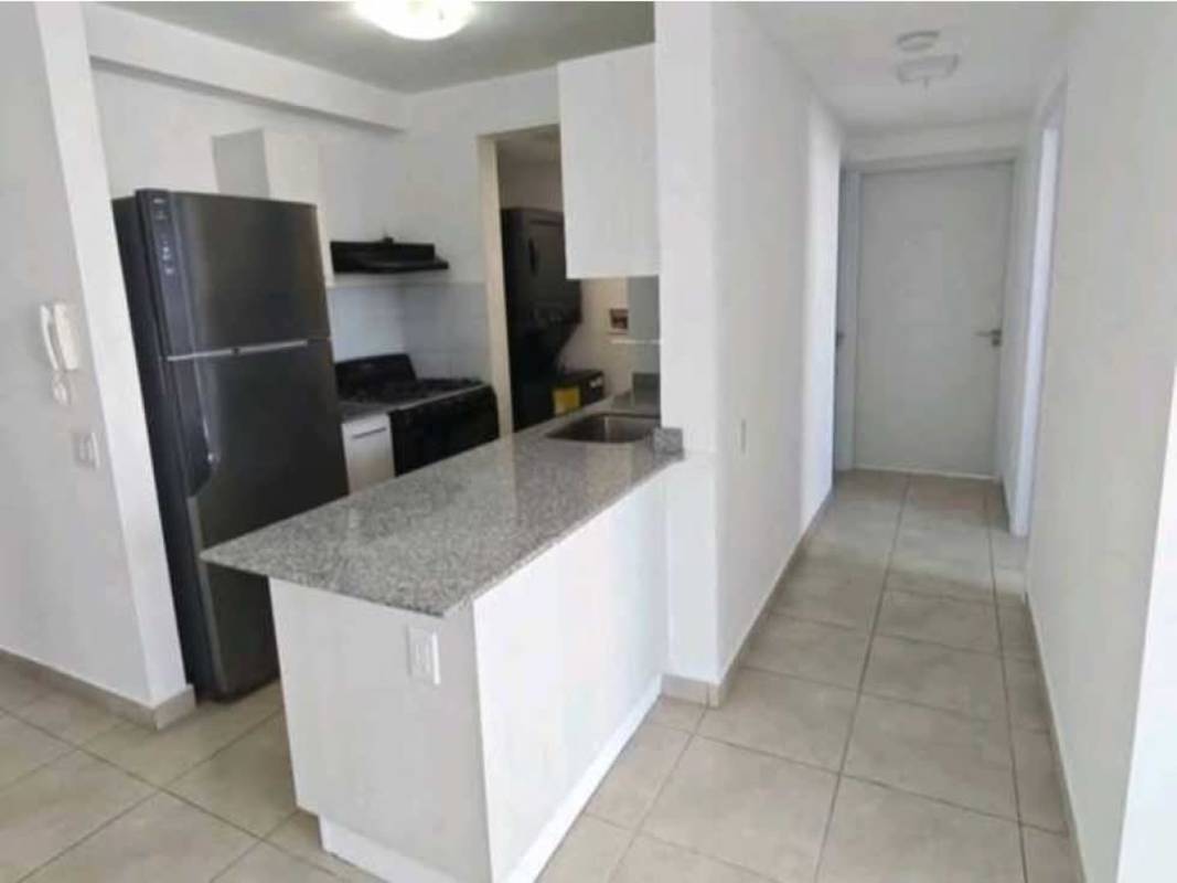 Minimalist kitchen with granite countertop, stainless steel refrigerator and stove in PH Doce de Octubre Panama