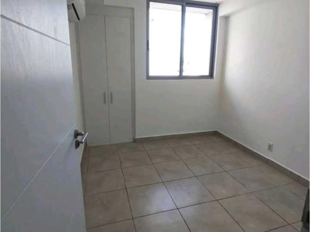 Empty bedroom with tile floor, built-in closet, air conditioner at PH Doce de Octubre Panama City