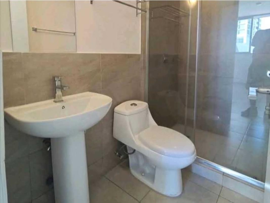 Bathroom with glass-enclosed shower, pedestal sink, tile walls PH Doce de Octubre Panama