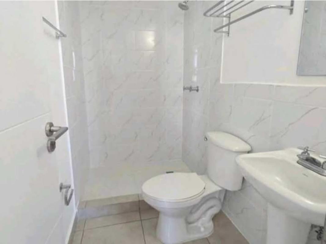 Modern lobby with seating area, glass doors, elevator in PH Doce de Octubre Panama City