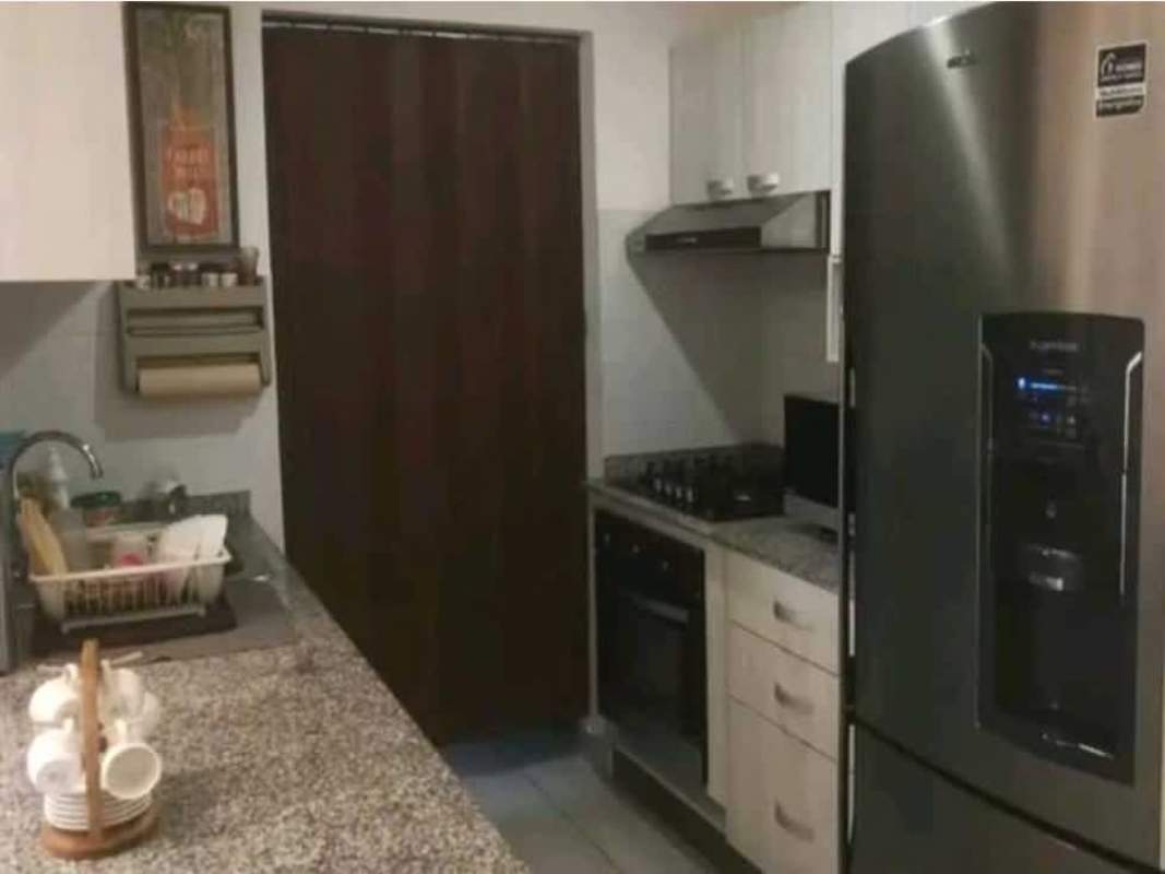 Modern kitchen with granite countertops and stainless appliances in PH Lefevre 75 Panama