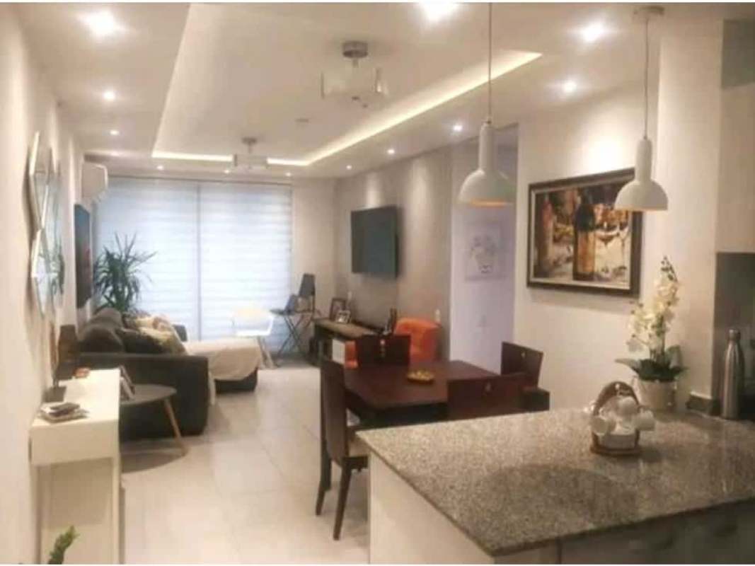 Rooftop swimming pool with colorful panels and city skyline views at PH Lefevre 75 Panama