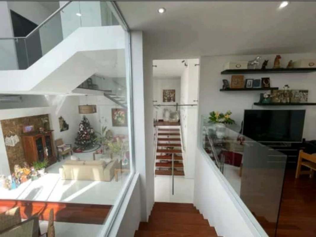 Private tropical pool with sun loungers, lush garden in luxury home Altos del Golf Panama City