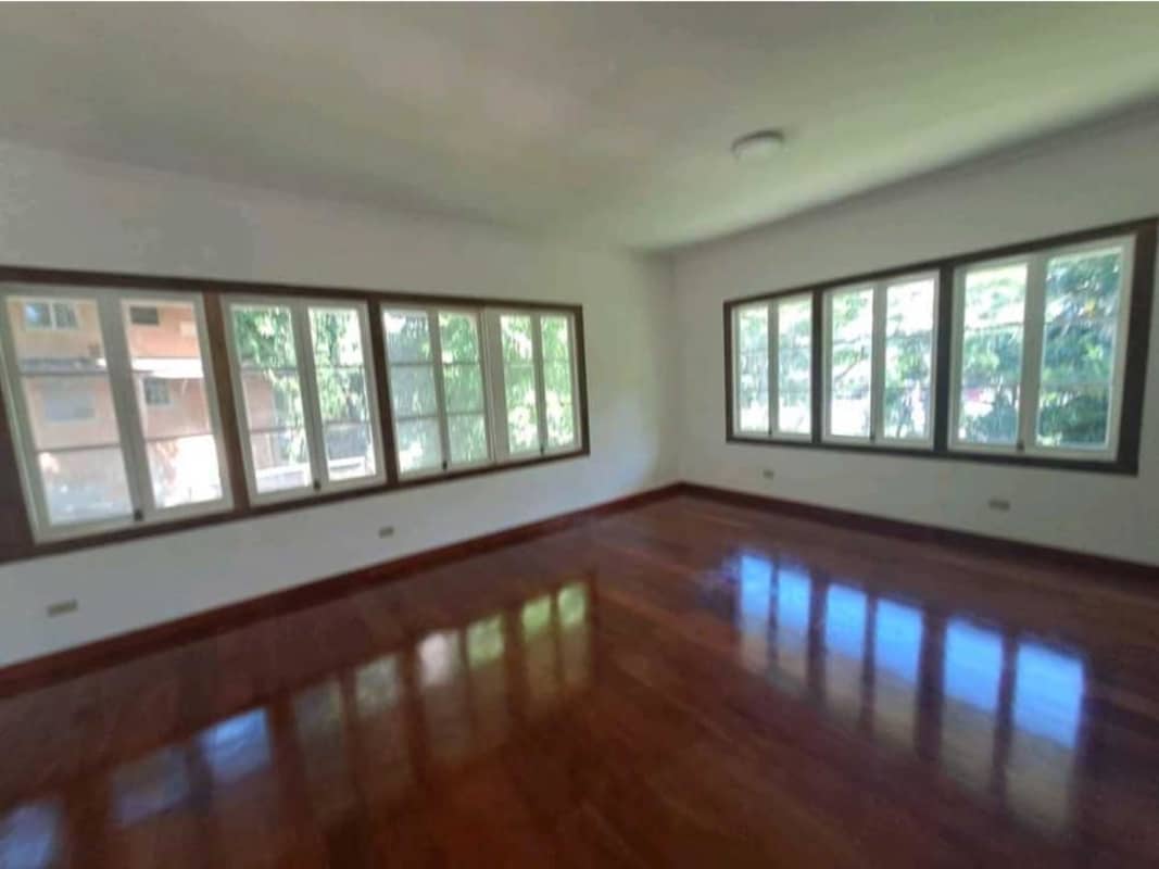 Kitchen with wooden cabinets granite countertops double sink window in Diablo Ancon Panama City