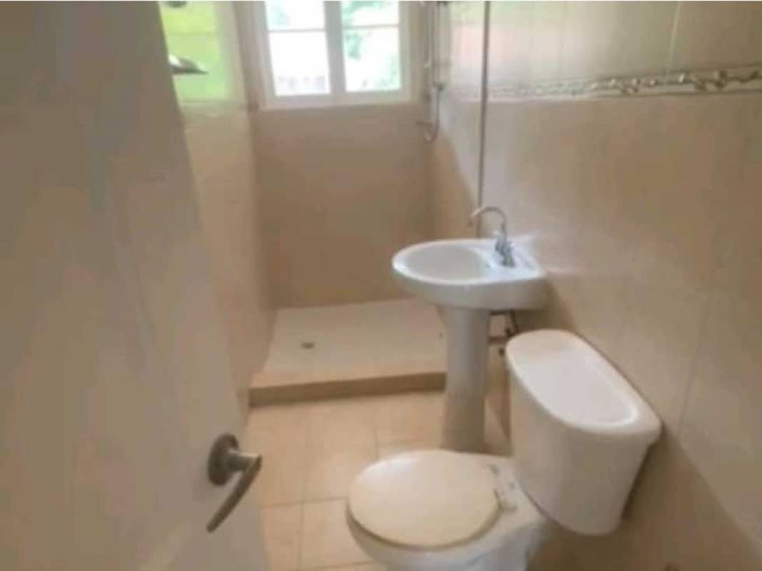 Extensive fenced green garden yard with mature trees in Balboa Panama