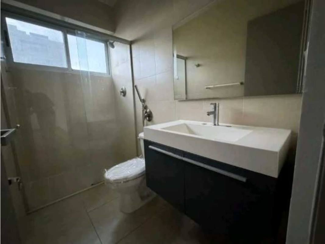 Modern bathroom with large mirror and glass shower enclosure in PH BICSA Tower Panama