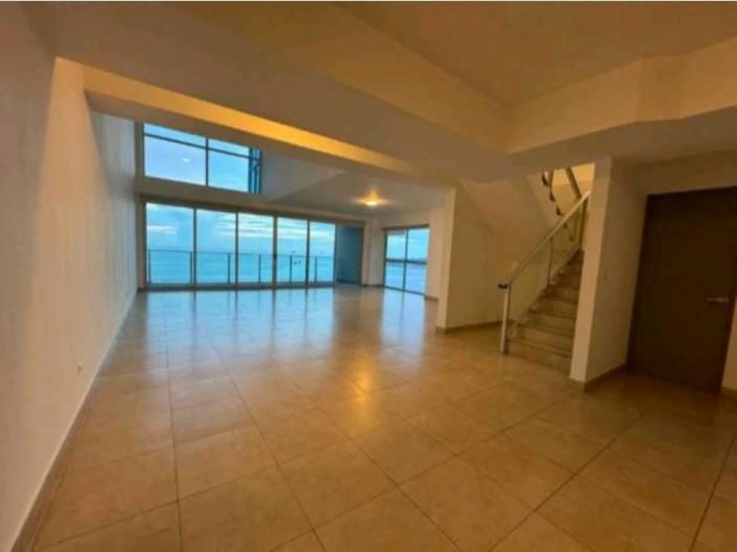 Modern living area with floor-to-ceiling windows overlooking Pacific and city at PH BICSA Tower Panama