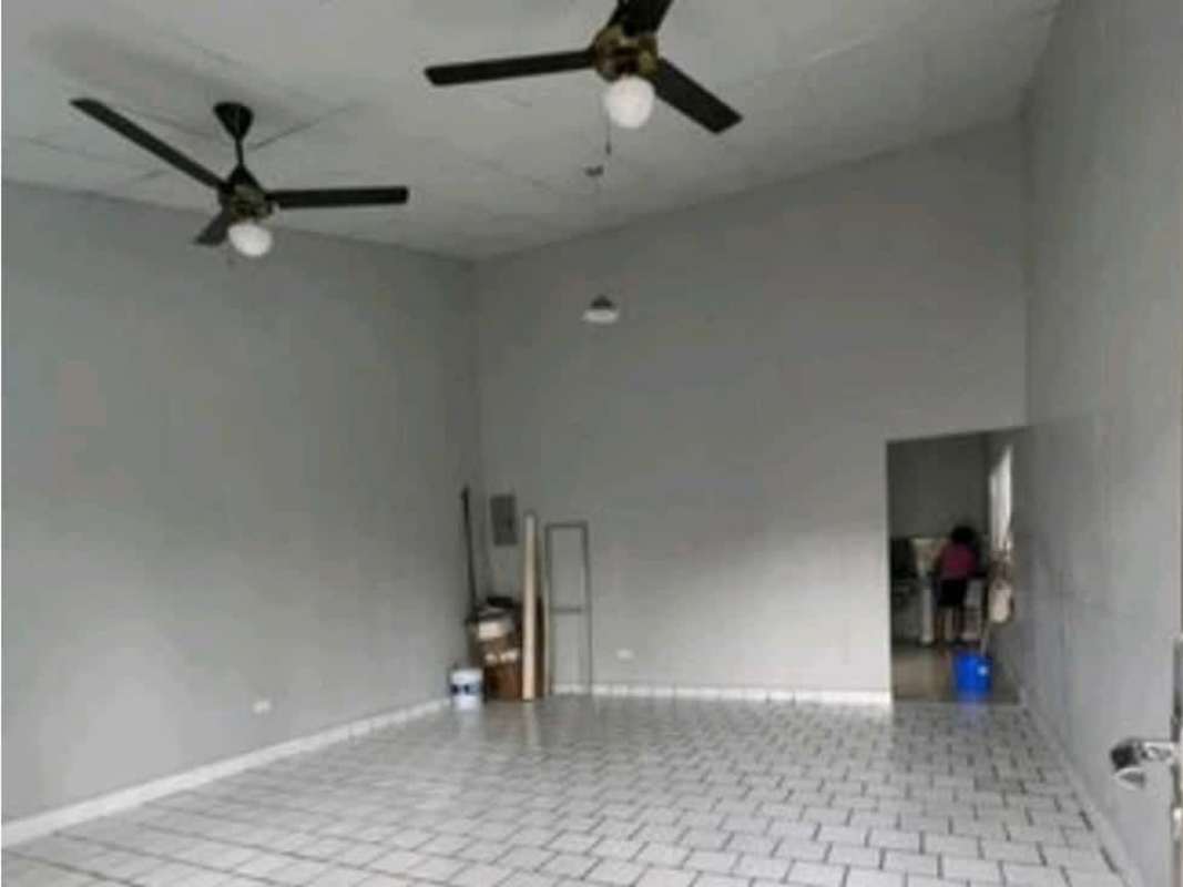 Open floor large tiled interior space with ceiling fans in investment house Rufina Alfaro Panama