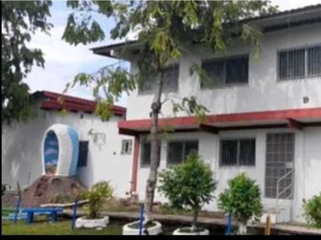 Front yard garden with religious grotto and block perimeter wall Rufina Alfaro San Miguelito