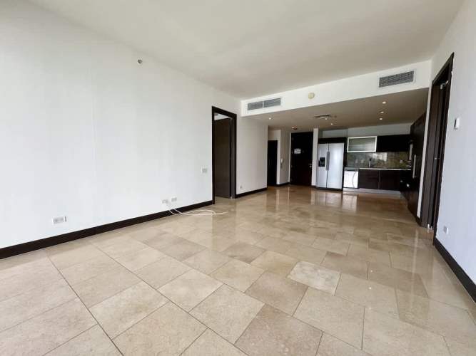 Large balcony with glass railing offering Pacific Ocean and skyline views at Pacific Sky Punta Pacifica