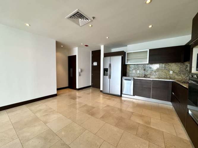 Contemporary kitchen with granite countertops and appliances in Pacific Sky Punta Pacifica Panama City