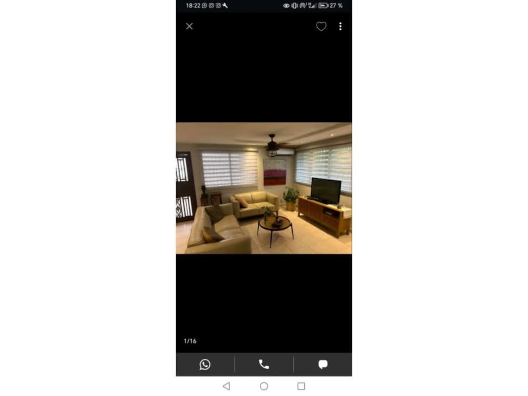 Living room with beige sofa, large windows, tile flooring, in Condado del Rey Panama for sale