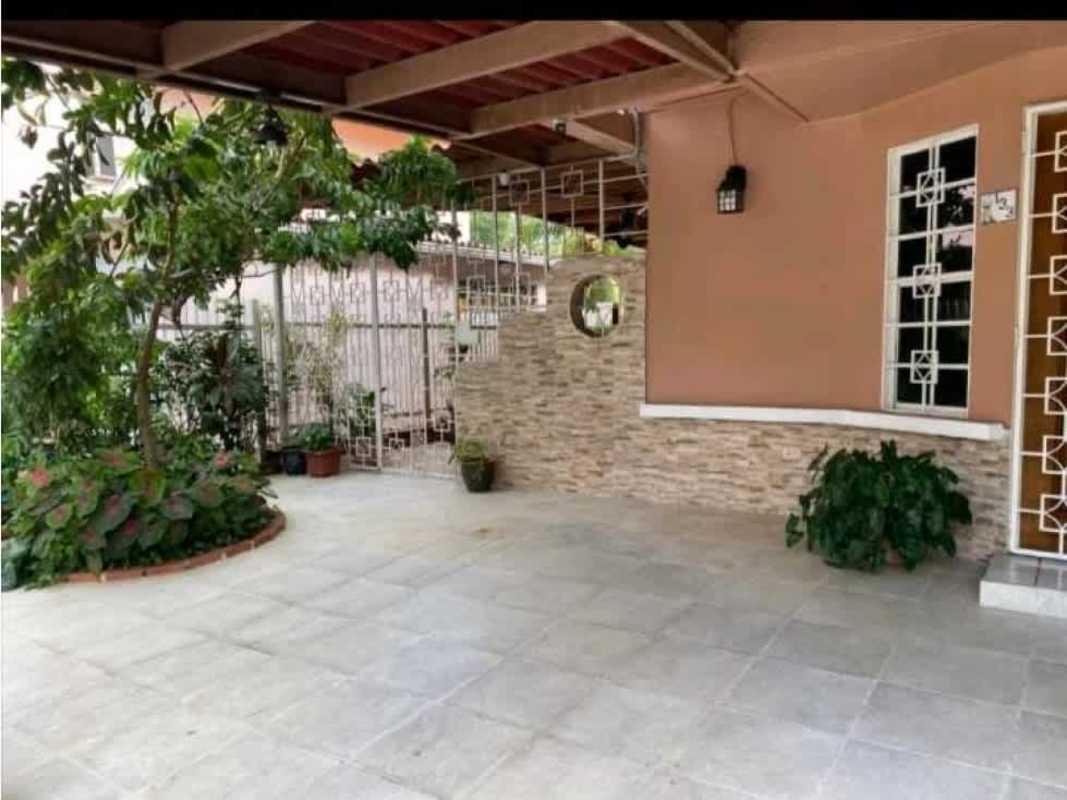Covered porch entryway with garden, plants and gated entrance Condado del Rey Panama for sale