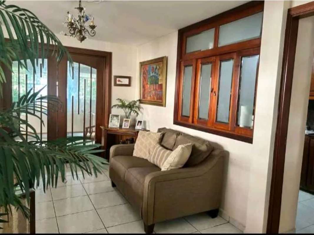 Kitchen with wooden cabinets, granite counters, stainless appliances in Condado del Rey house for sale