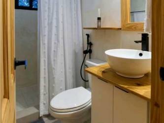 Large primary bedroom bright decor garden views gated golf resort Coronado Panama