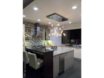 Aerial view of rocky shoreline, bay, and city skyline from Punta Paitilla Panama waterfront