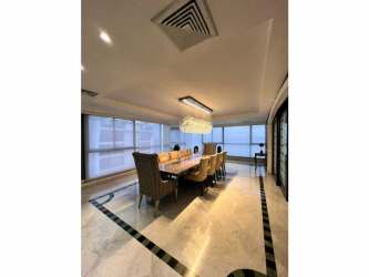 Luxury enclosed ocean-view balcony with seating and panoramic views in Punta Paitilla Panama