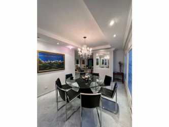Elegant open living space with marble flooring and recessed lighting in Punta Paitilla oceanfront condo