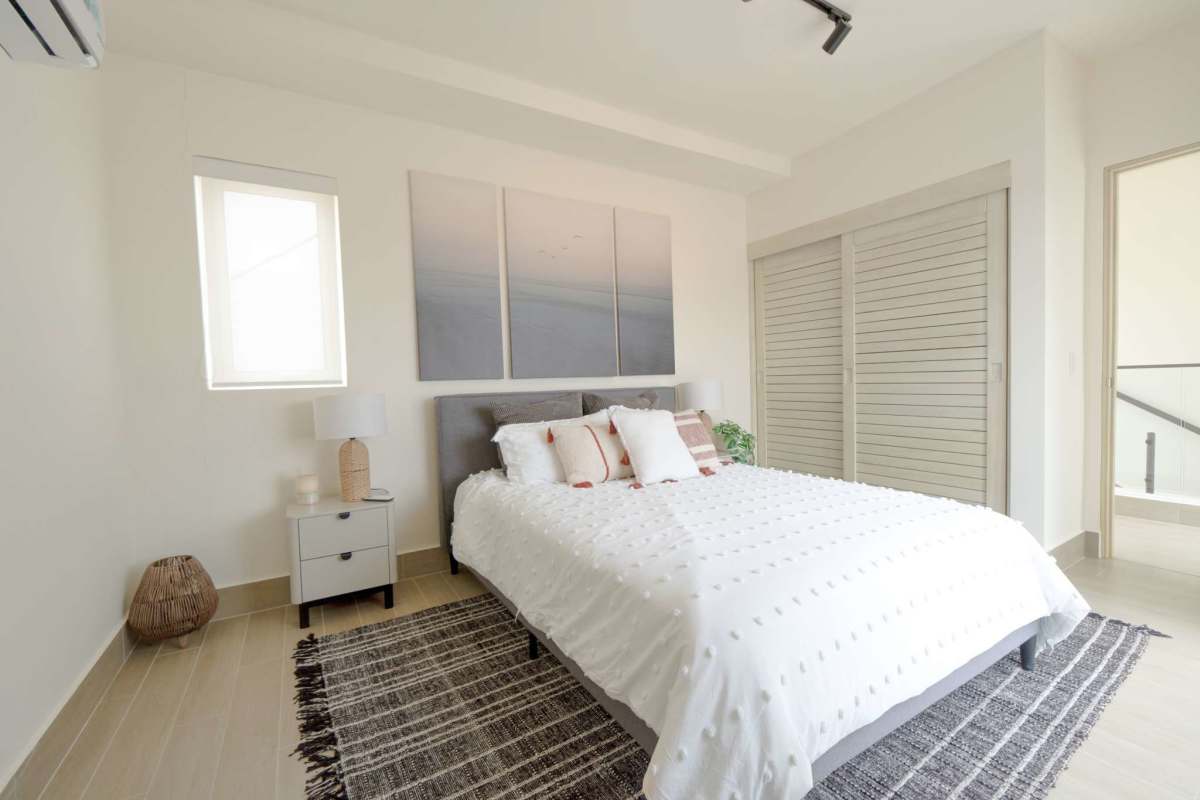 Modern bedroom with closet in The Tides beachfront townhouse Playa Caracol