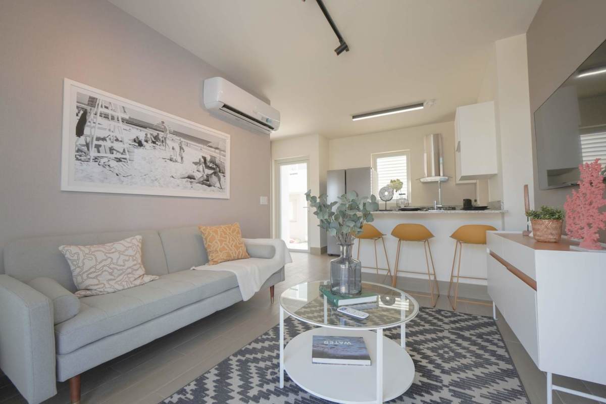 Fully equipped modern kitchen with granite island at beachfront townhouse Playa Caracol