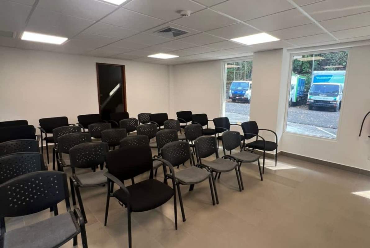 Minimalist white cabinetry modern kitchen large window Quarry Heights Panama