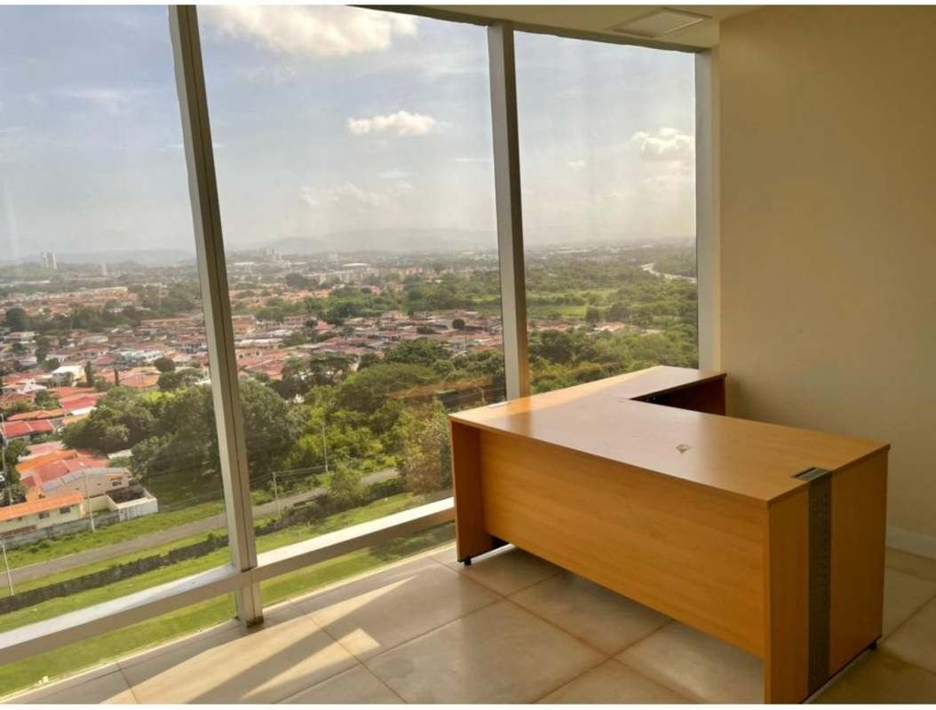 Open workspace glass windows panoramic city view Costa del Este office rental Panama City