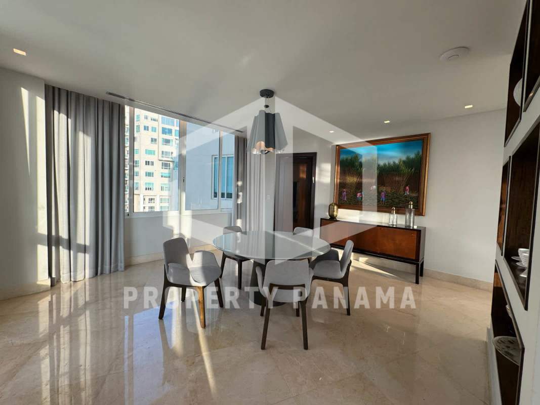 Luxurious master suite with floor-to-ceiling windows ocean views Punta Pacífica Panama luxury condo
