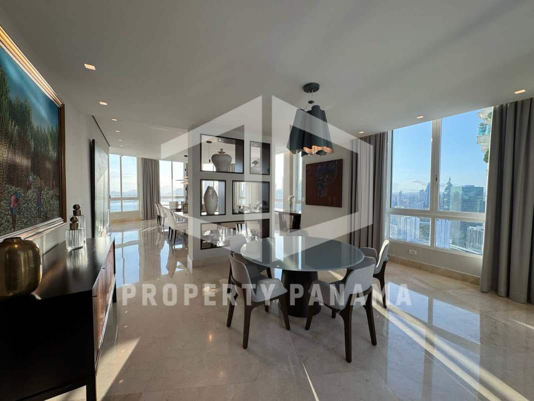 Open-plan living dining with marble floors and skyline Pacific Ocean views at Punta Pacífica Panama City