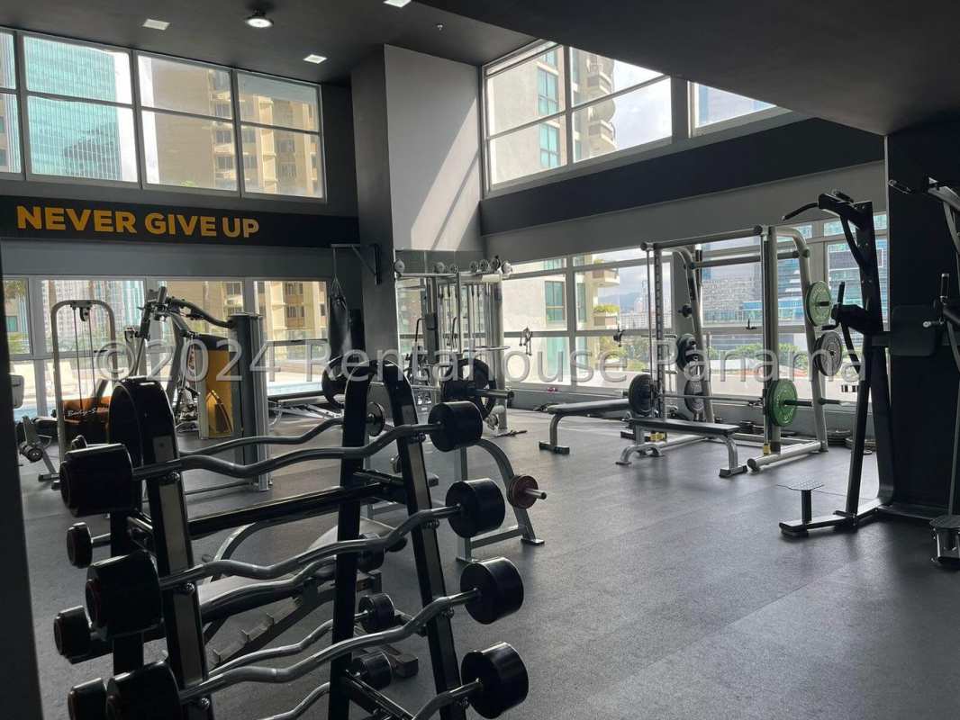 Open-plan living and dining room with marble floors and ocean views in PH Q Tower Punta Pacifica