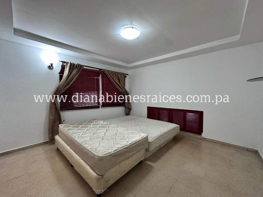 Spacious master bedroom with tray ceiling, large window and closet in Villas de las Fuentes Panama