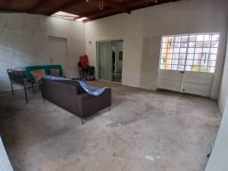 Basic interior with sofa large window exposed ceiling Villas de Arraiján Panama Oeste