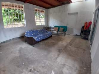 Unfinished rustic living area glass block windows Villas de Arraiján Panama