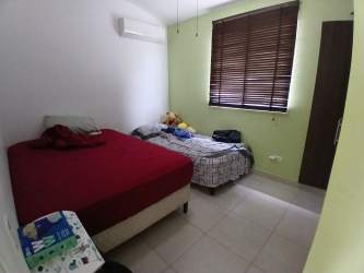 Bedroom double single beds window wooden blinds Villas Arraiján Panama