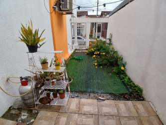 Backyard with patio grass potted plants Villas de Arraiján Panama Oeste