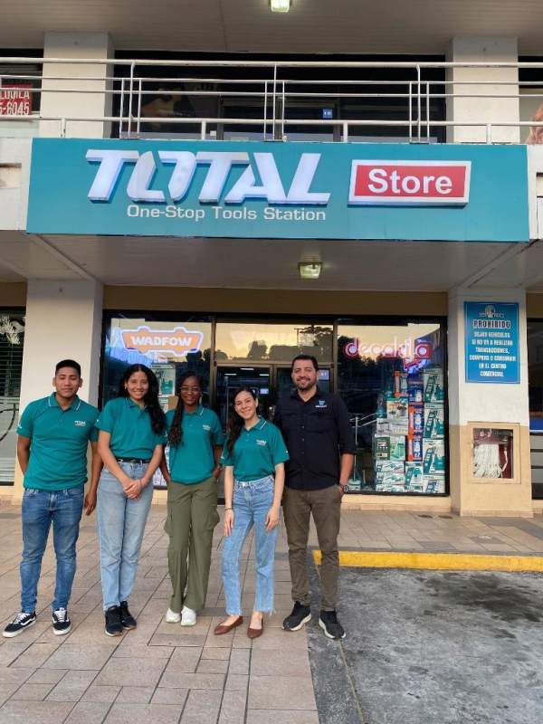 Glass entrance of Total tool store with staff in Plaza Los Andes Panama City